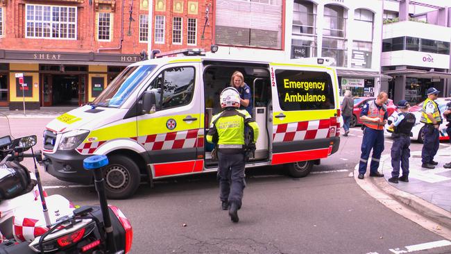 Paramedics and police at the scene on the corner of New South Head Rd and Knox St in Double Bay on Wednesday. Picture: OnScene Bondi