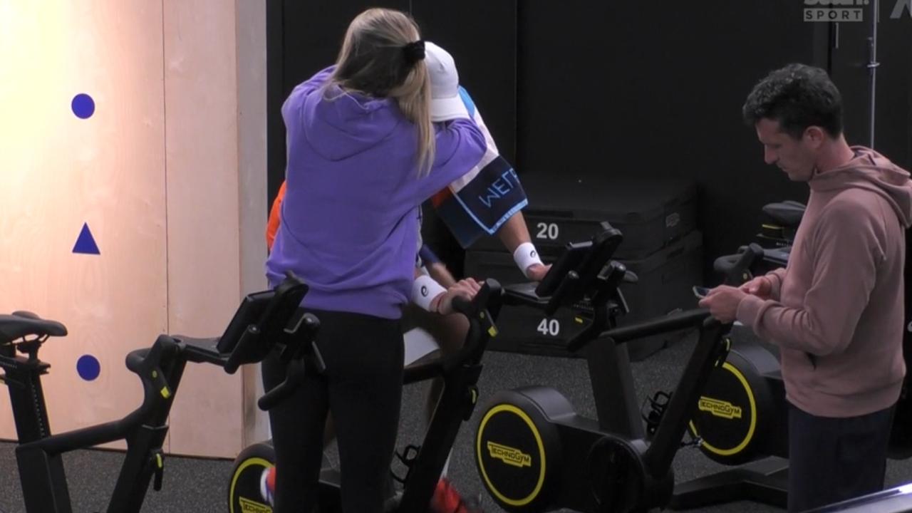 Katie Boulter consoles Alex de Minaur after his five-set loss to Andrey Rublev.