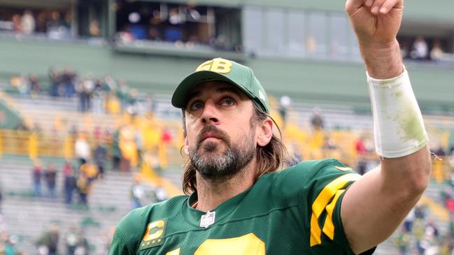 GREEN BAY, WISCONSIN – OCTOBER 24: Aaron Rodgers #12 of the Green Bay Packers celebrates after beating the Washington Football Team 24-10 in the game at Lambeau Field on October 24, 2021 in Green Bay, Wisconsin. (Photo by Stacy Revere/Getty Images)