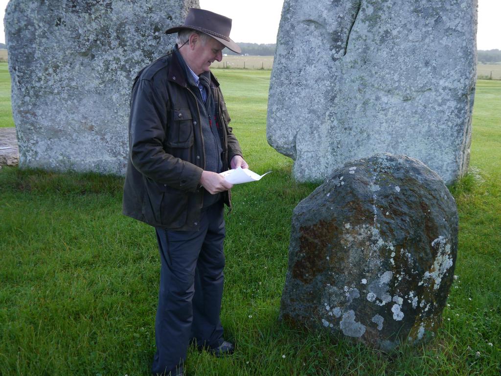 Professor Chris Kirkland examining monoliths at Stonehenge.