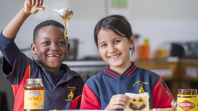 St Albans Meadows Primary students Obed, 6, and Oceana, 7, celebrate a Vegemite victory. Picture: Jason Edwards