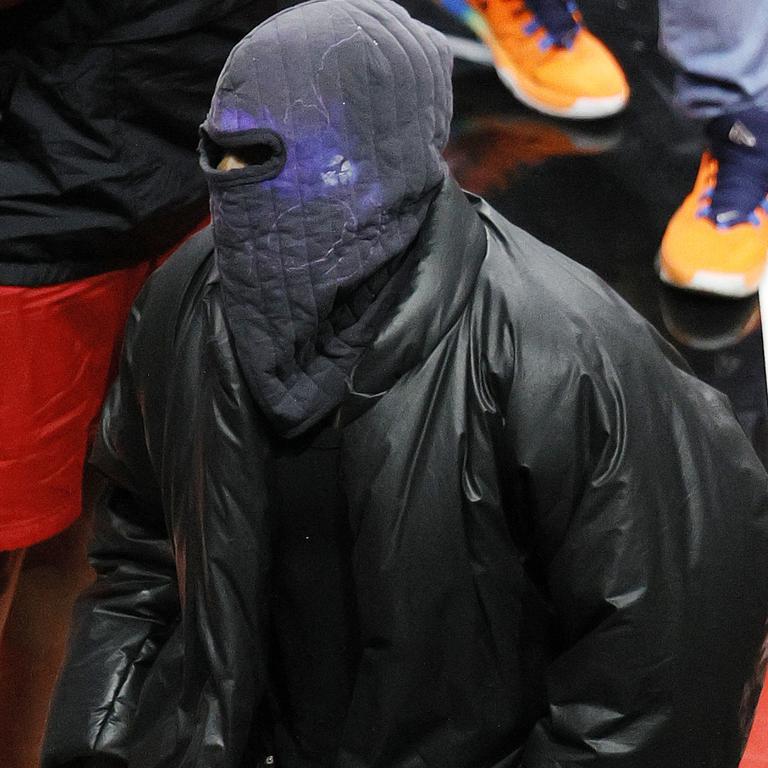 Kanye’s been spotted in the stadium wearing full face masks. Picture: Getty