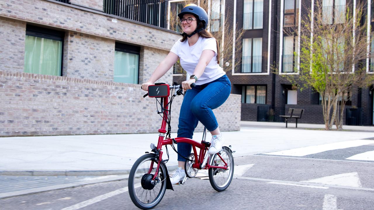 The Swytch kit on a small-wheeled bicycle.