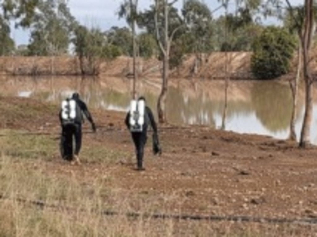 Police released images of divers searching a body of water as they continue their search for Jack McLennan, who disappeared near Ficks Crossing at Murgon 12 days ago.