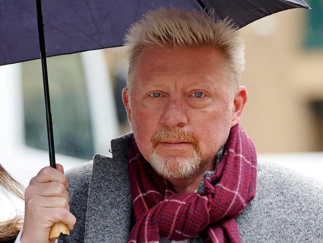 (FILES) In this file photo taken on April 6, 2022 Former tennis player Boris Becker shelters from the rain beneath an umbrella as he arrives at Southwark Crown Court in London, as his trial over charges relating to his bankruptcy continues. - German tennis great Boris Becker will hear his sentencing on April 29, when he could face a jail sentence of up to seven years. (Photo by Tolga Akmen / AFP)