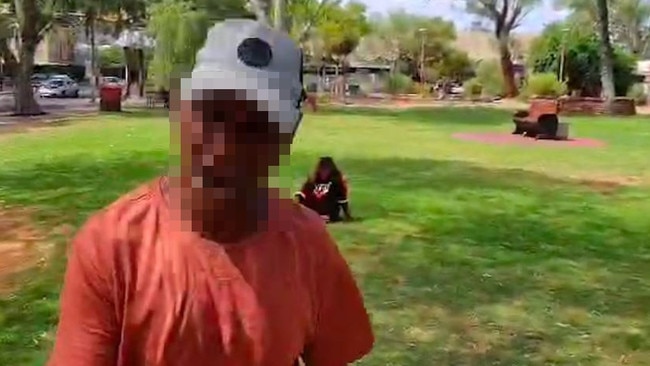 A brutal domestic violence incident takes place in broad daylight on the grass outside the Town Council Chambers in Alice Springs.