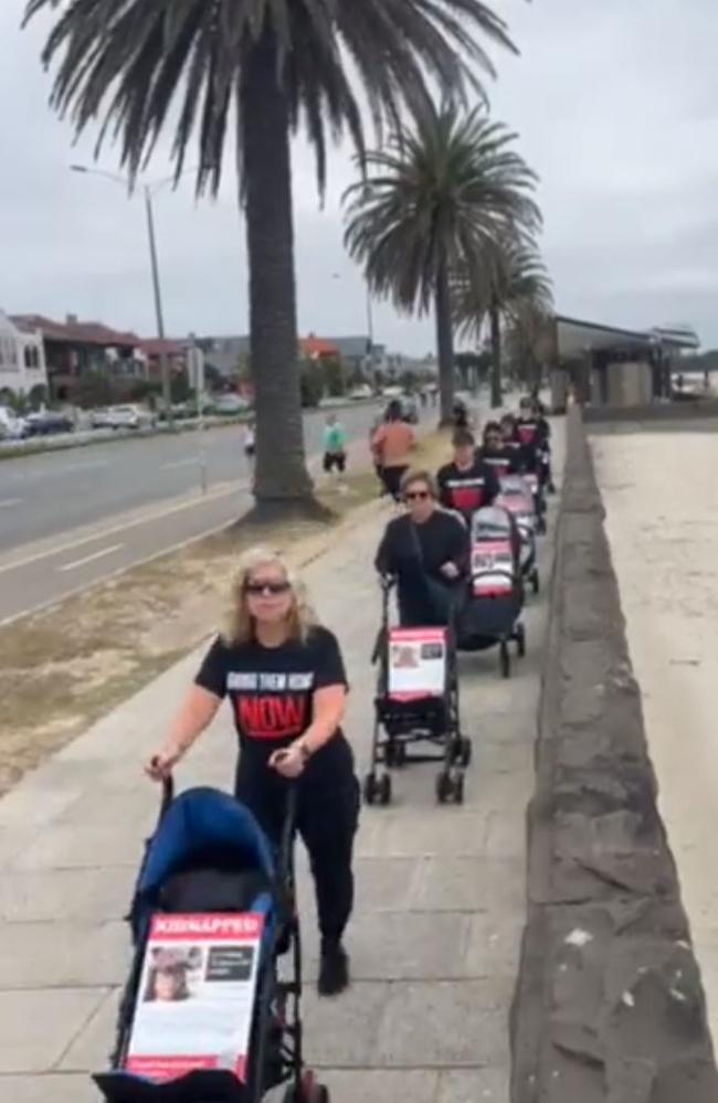 Members of the Jewish community marched along Beaconsfield Parade pushing empty strollers with pictures of more than 30 children held hostage by Hamas terrorists in Gaza. Picture: Twitter