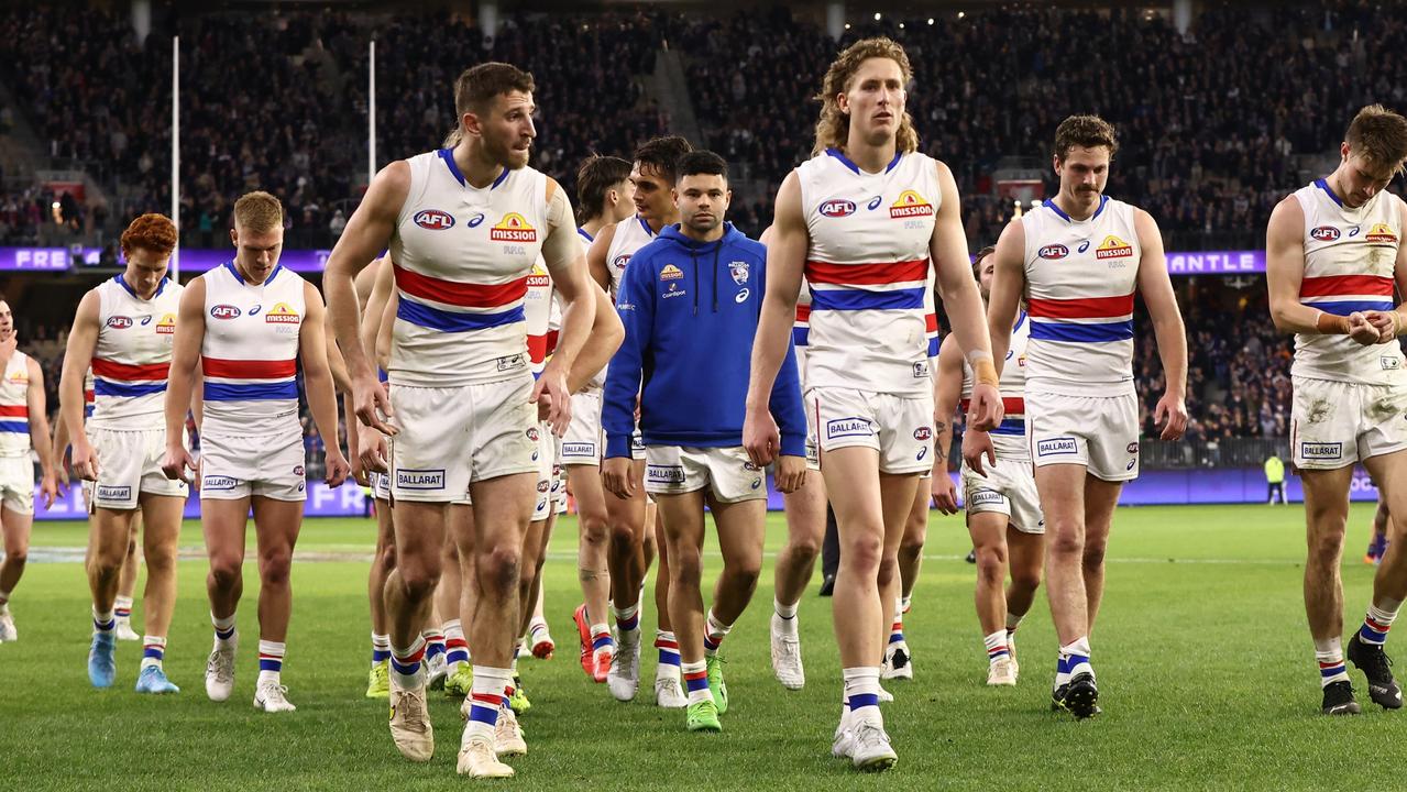 The Bulldogs walk from the field after the elimination final loss. Picture: Paul Kane