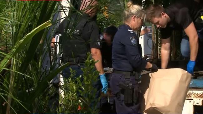 Police officers examine a truck stopped in Elanora on the Gold Coast on Friday April 29 which was allegedly found to be carrying 136kg of cannabis. Picture: Nine Gold Coast News