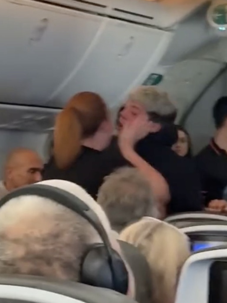 The woman was filmed being hit in the face during her meltdown.