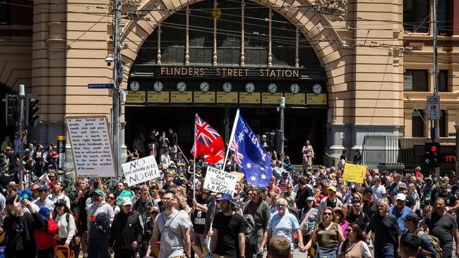 Protesters walk down Flinders Street on November 27 in Melbourne. Picture: Getty Images