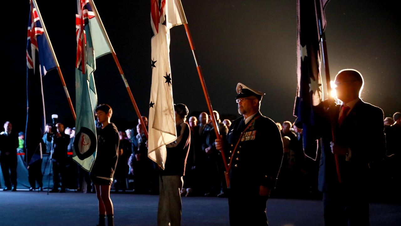 Flag-bearers assemble at the beginning of the Anzac dawn service at Pinegrove Memorial Park in Minchinbury. Picture: Angelo Velardo