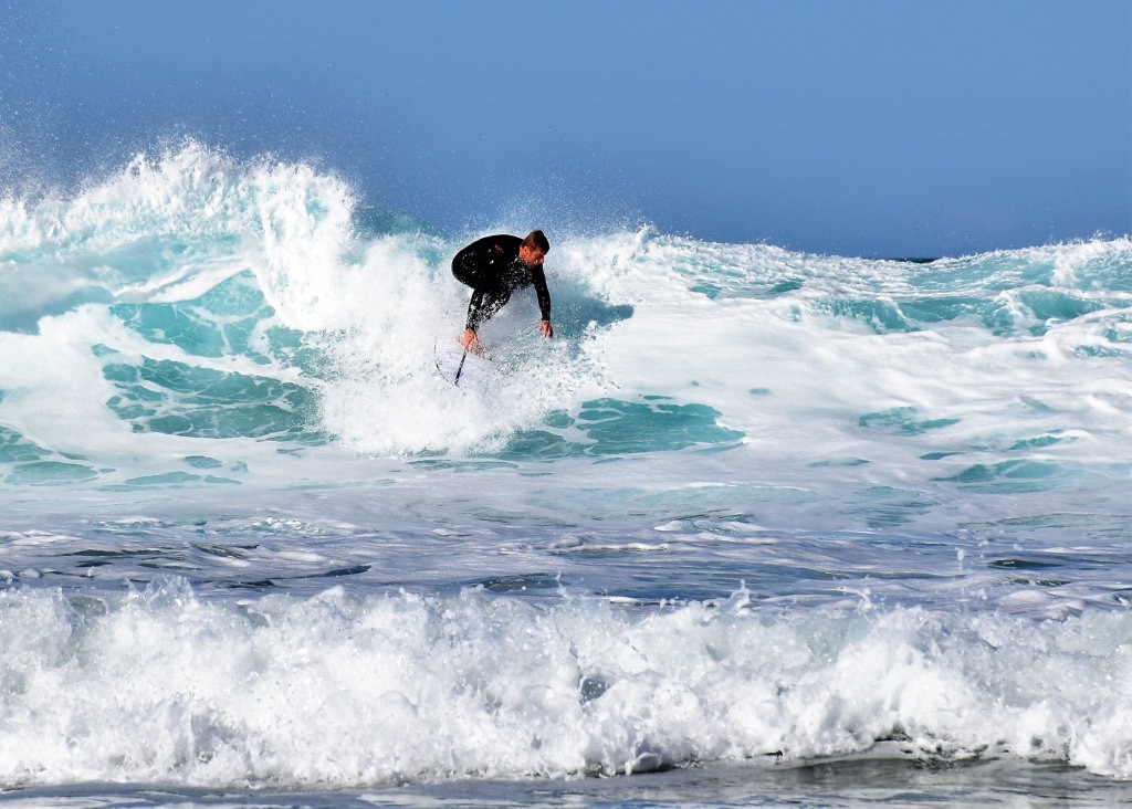 Surfers and bodyboard riders making the most of the waves at Kawana on the weekend. Picture: Mark Furler