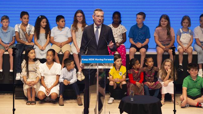 The Premier delivered his policy flanked by around three dozen children. Picture: NewsWire/ Monique Harmer