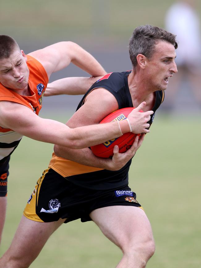 GFL: Geelong West Giants v Grovedale. 8,16. Grovedale's Tim Delaney breaks clear from Geelong West's Maxwell Kelly. Picture: Mike Dugdale