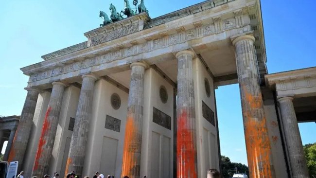 Police arrested 14 protestors at the Brandenburg Gate and launched an investigation to assess how much damage was done to the property. Picture: Getty Images