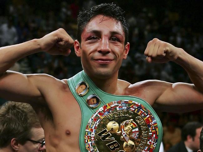 LAS VEGAS - SEPTEMBER 16: Israel Vazquez celebrates after defeating Jhonny Gonzalez of Mexico after their WBC super bantamweight titile fight at the MGM Grand Garden Arena September 16, 2006 in Las Vegas, Nevada. Vazquez retained his title after defeating Gonzalez by TKO in the 10th round. (Photo by Ethan Miller/Getty Images)