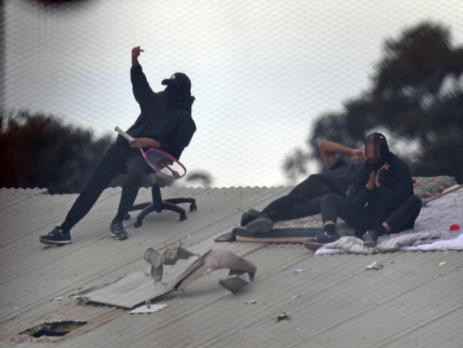 Detainees are seen during a riot at the Frank Baxter Juvenile Justice Centre, Kariong, NSW, Monday, July 22, 2019. A riot has broken out at a NSW juvenile justice centre on the Central Coast where several inmates have climbed onto the roof and five inmates have been stabbed. Picture: AAP / Dean Lewins