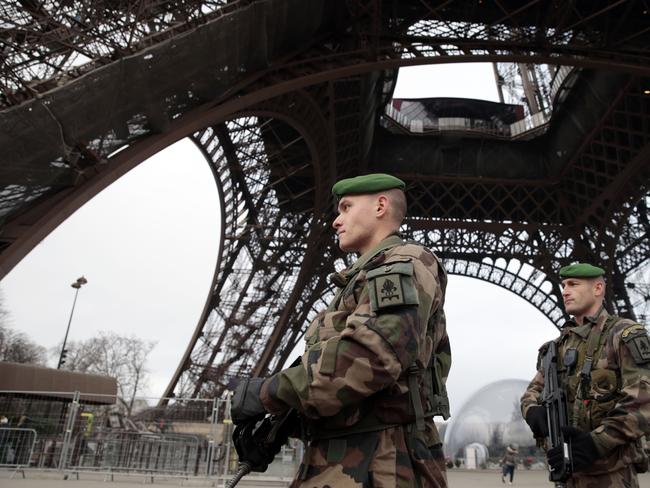 French soldiers patrol the Eiffel Tower in Paris as the capital was placed under the highest alert status. Picture: Joel Saget