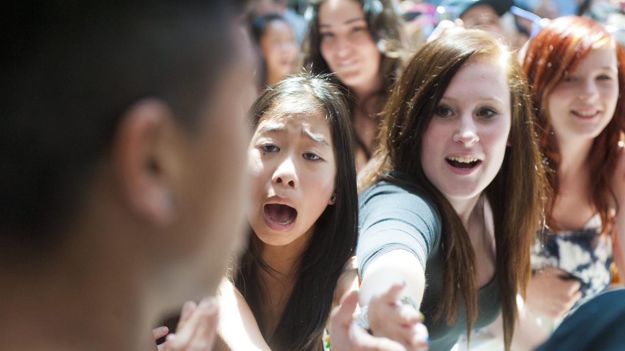 Hysterical fans go crazy for boy bands and male performers when Justice Crew performed at Westfield a decade ago.