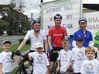 GOOD CAUSE: Bob Montgomery and his team at one of the stops on their way to Port Douglas.