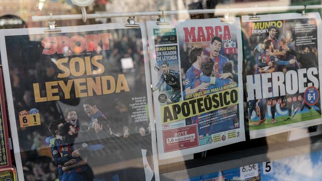 A picture taken on March 9, 2017 shows frontpages of sports newspapers.
