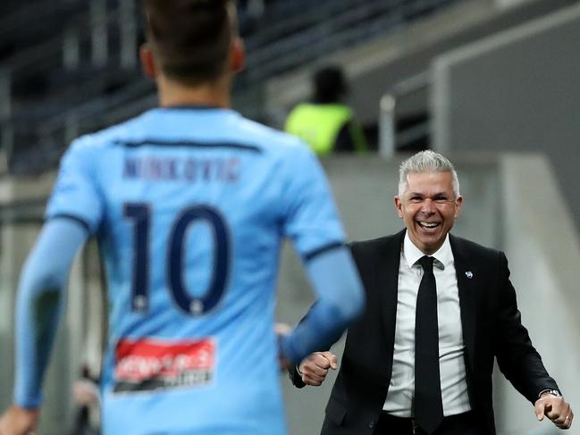 Milos Ninkovic of Sydney FC celebrates a goal with coach Steve Corica during the A-League Semi Final match between Sydney FC and Perth Glory at Bankwest Stadium. Picture. Phil Hillyard