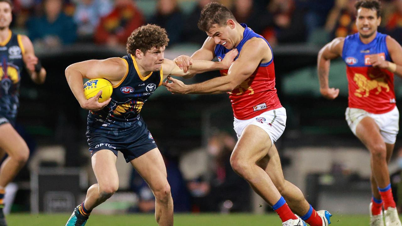 Harry Schoenberg fends off his Lions defender. Picture: Getty Images