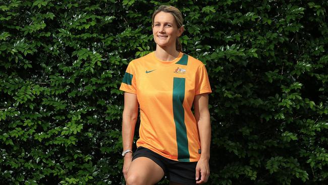 Retired Matilda's defender(1996-2009) Di Cleary poses with her former National representative soccer uniform and speaks with the Cairns Post about her career in Soccer.PICTURE: JUSTIN BRIERTY