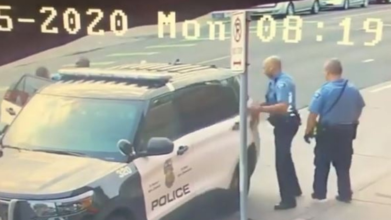 The officer who was struggling in the car then slams the door. Picture: Instagram/@shaunking