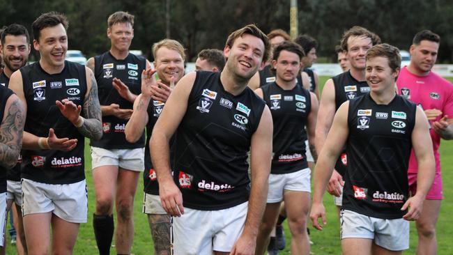 Lachlan Thompson, centre, with Benalla All Blacks teammates after kicking his 100th goal for the season. Picture: Garry Jones