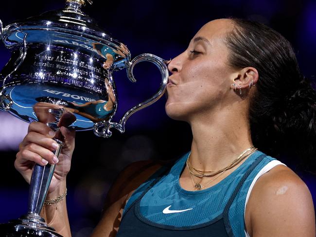 USA's Madison Keys celebrates with the Daphne Akhurst Memorial Cup after defeating Belarus' Aryna Sabalenka during their women's singles final match on day fourteen of the Australian Open tennis tournament in Melbourne on January 25, 2025. (Photo by Martin KEEP / AFP) / -- IMAGE RESTRICTED TO EDITORIAL USE - STRICTLY NO COMMERCIAL USE --