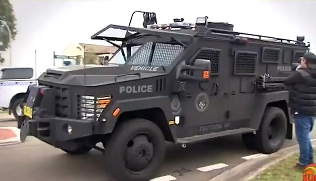 Tactical police raiding the Kellyville house. Picture: Seven News