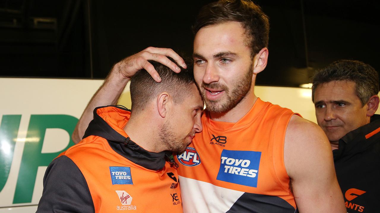 Brett Deledio hugs teammate Jeremy Finlayson after prelim final. Pic: Michael Klein.