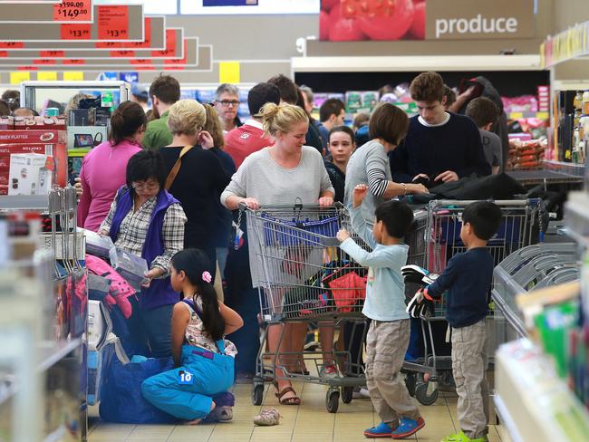 Keen shoppers sort through ski clothes and accessories at Aldi in Queensland hoping to grab bargains at the annual ski sale. Picture: Claudia Baxter