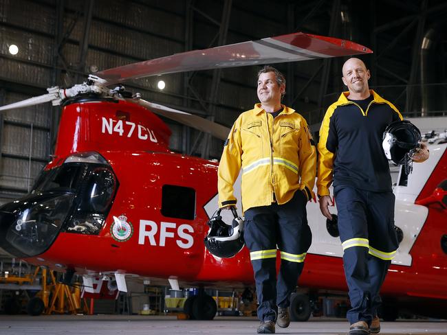 WEEKEND TELEGRAPHS - 15.9.23MUST NOT PUBLISH BEFORE CLEARING WITH WEEKEND PIC EDITOR - RFS helicopter pilots (L to TR) Nathan Foster and John Fryer picture in front of the new Chinook helicopter they will fly this summer. Picture: Sam Ruttyn