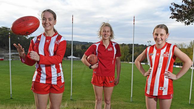 06/05/20 - Mount Lofty A grade women Maddy Taylor (jumper) and Holly Aiston (polo) with under 14's Keira May, can't wait to get back to playing footy. Picture: Tom Huntley