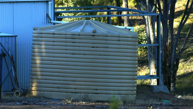 A water tank at the squalid bush camp in the hills near Yass, NSW where the Colts went to live after the patriarch Tim died in WA in 2009.