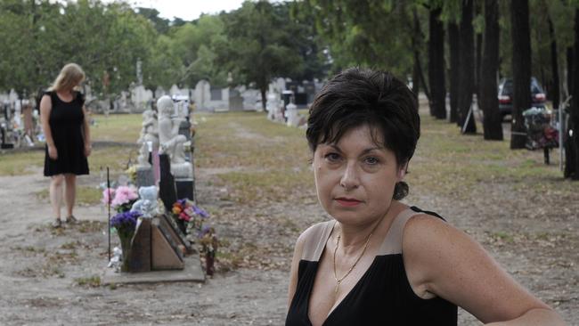 Liz Oliver (front) and Simone Hamilton were angered at plans to take out trees at a Fawkner graveyard.