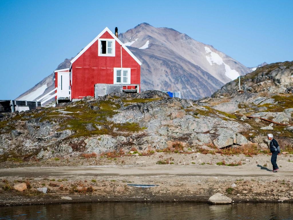 A resident of Kulusuk walks in Kulusuk, Greenland on August 20, 2019. Picture: AFP