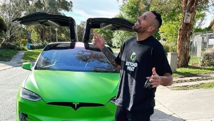 Nick Kyrgios with his bright green Tesla, which the offender stole last year. Picture: Instagram