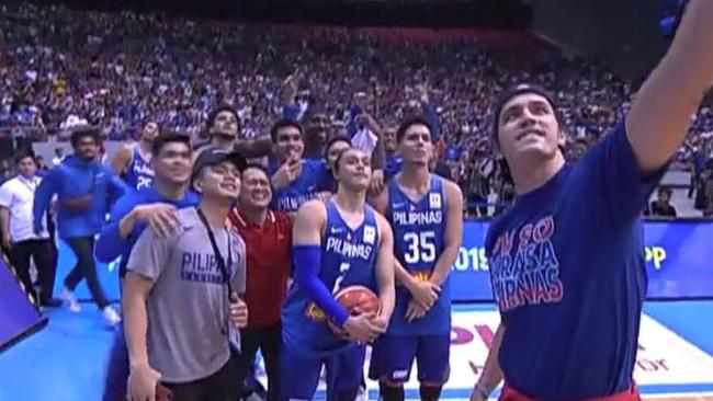 Philippines team members pause to pose for a selfie after the ugly fight. Picture: Fox Sports