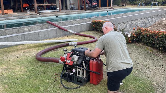 Mr Hensen used water from the neighbour’s pool to feed water to the pumps and keep the watering down of the house ongoing. Picture: Rory Wynbergen