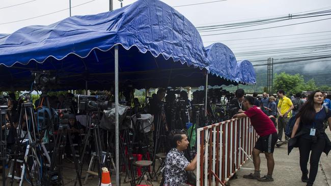 Journalists wait at the new media centre. Picture: AFP.