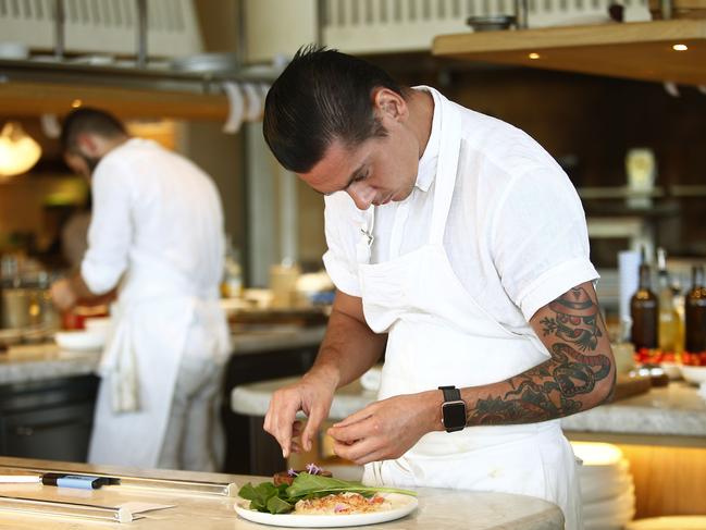 Senior Sous Chef Jake Kellie at work at Mimis. Lunch with Leo. Leo Schofield lunches with Composer and Author Paul Kildea at Mimis at Coogee Pavillion. Picture: John Appleyard