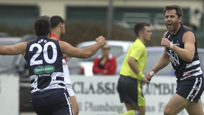 Noarlunga captain Tom Caudle celebrates a goal during a match this season with teammate Reece Martell. They have booted 88 goals between them in 2019. Picture: AAP/Dean Martin