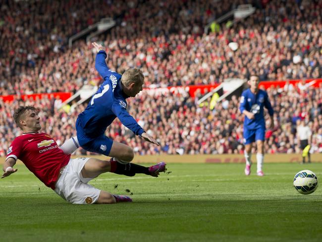 Tony Hibbert is brought down by Luke Shaw.