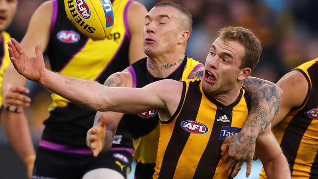 Tom Mitchell is tackled high by Dustin Martin. Picture: Michael Klein