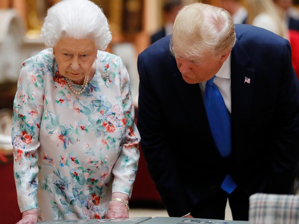 He viewed American artefacts with the Queen. Picture: Tolga AKMEN / POOL / AFP.