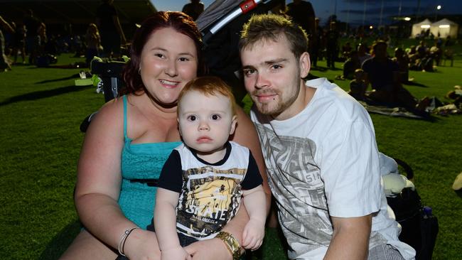 Shana Maguire and Martin Pickering with Jesse, 1, at North Ipswich Reserve for New Year’s Eve 2015. Picture: David Nielsen
